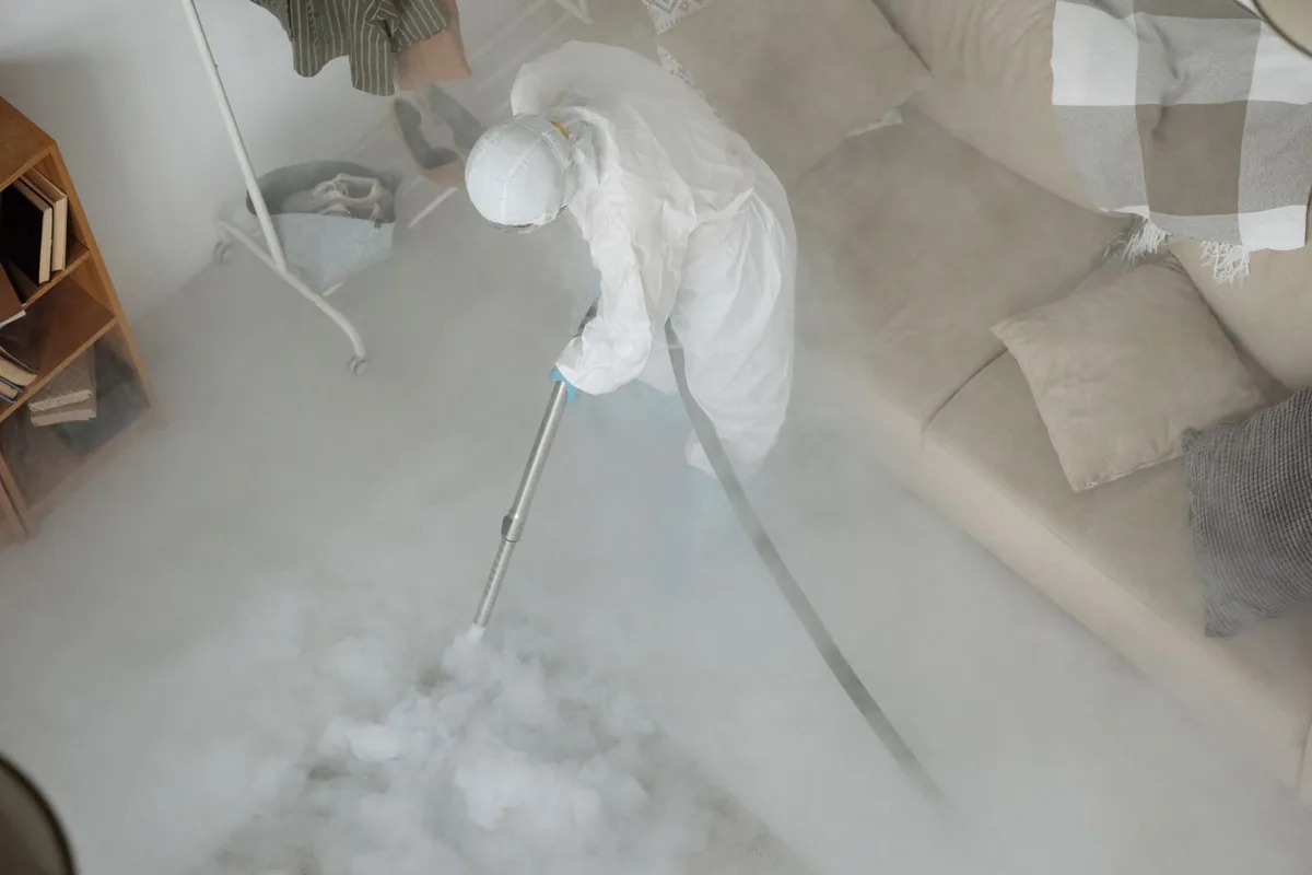 Biohazard cleanup technician in protective equipment, Oconto Falls, WI